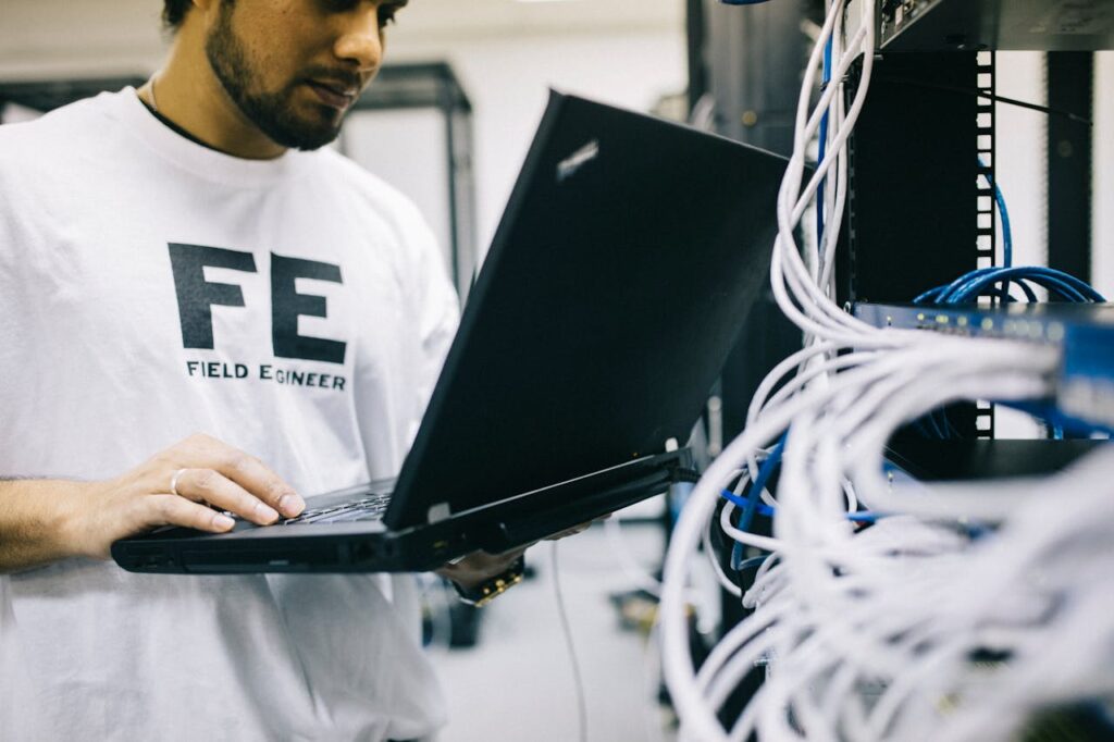 Person examining hardware for issues